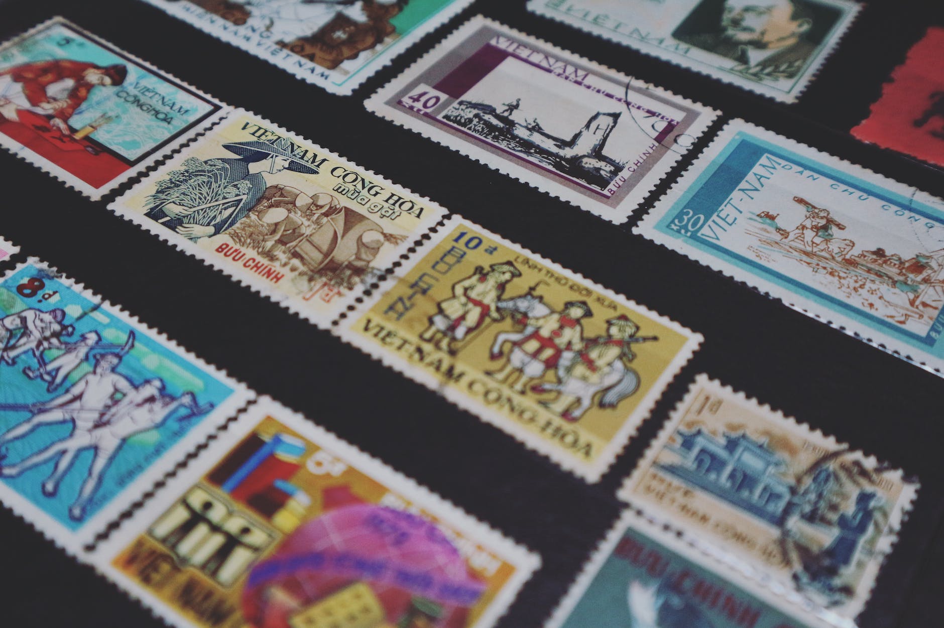 assorted colored vietnam postage stamps